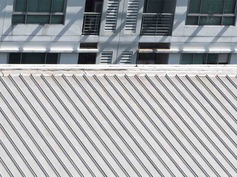Dirty old metal texture roof of building and top view.